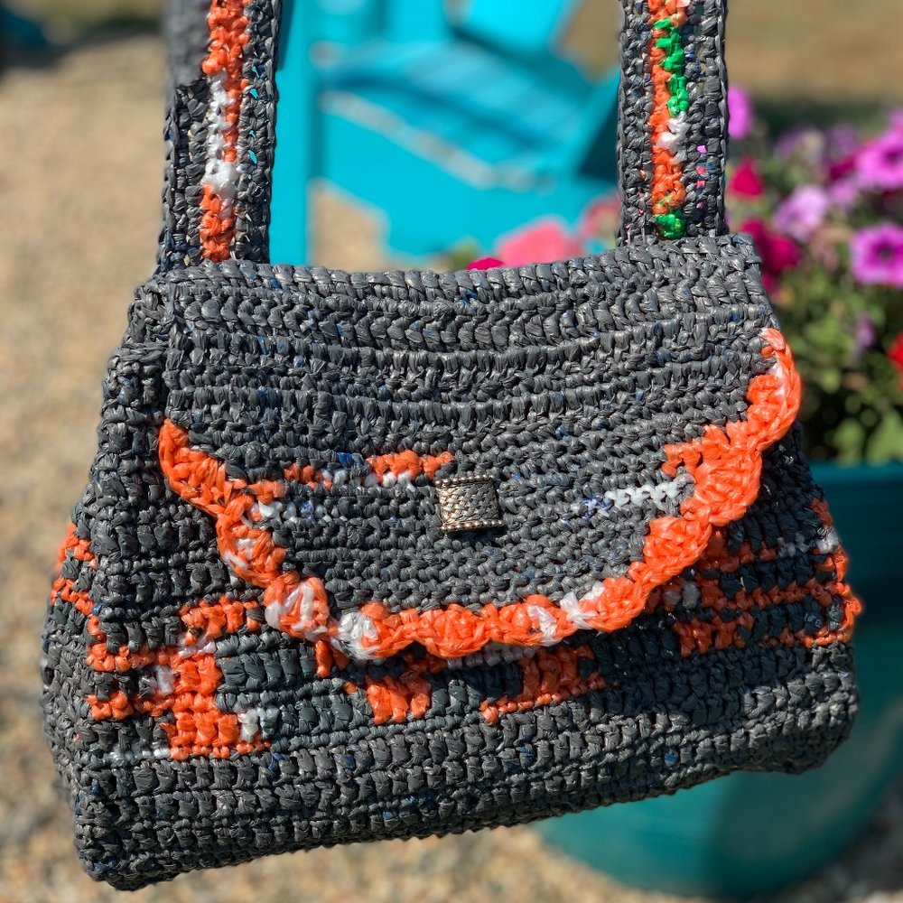 Crochet plarn cross body bag.  Handmade from recycled retail plastic bags.